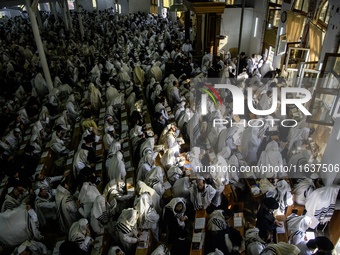 Ultra-Orthodox Jewish Hasidic pilgrims pray in the Synagogue of Bratslav Hasidim near the tomb of Rabbi Nachman on the eve of the Rosh Hasha...