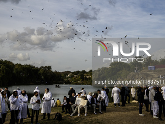 Ultra-Orthodox Jewish pilgrims pray on the bank of a lake near the tomb of Rabbi Nachman while celebrating Rosh Hashanah, the Jewish New Yea...