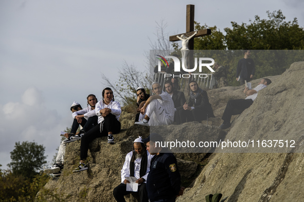 Ultra-Orthodox Jewish pilgrims pray on the bank of a lake near the tomb of Rabbi Nachman while celebrating Rosh Hashanah, the Jewish New Yea...