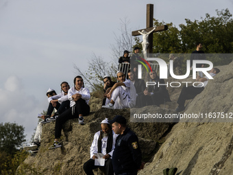 Ultra-Orthodox Jewish pilgrims pray on the bank of a lake near the tomb of Rabbi Nachman while celebrating Rosh Hashanah, the Jewish New Yea...