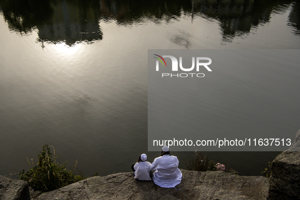 Ultra-Orthodox Jewish pilgrims pray on the bank of a lake near the tomb of Rabbi Nachman while celebrating Rosh Hashanah, the Jewish New Yea...