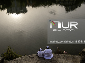 Ultra-Orthodox Jewish pilgrims pray on the bank of a lake near the tomb of Rabbi Nachman while celebrating Rosh Hashanah, the Jewish New Yea...