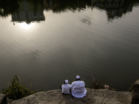 Ultra-Orthodox Jewish pilgrims pray on the bank of a lake near the tomb of Rabbi Nachman while celebrating Rosh Hashanah, the Jewish New Yea...