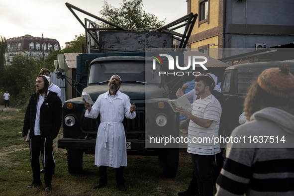 Ultra-Orthodox Jewish pilgrims pray near the tomb of Rabbi Nachman while celebrating Rosh Hashanah, the Jewish New Year, amid the ongoing wa...