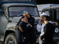 Ultra-Orthodox Jewish pilgrims talk on the street near the tomb of Rabbi Nachman while celebrating Rosh Hashanah, the Jewish New Year, amid...