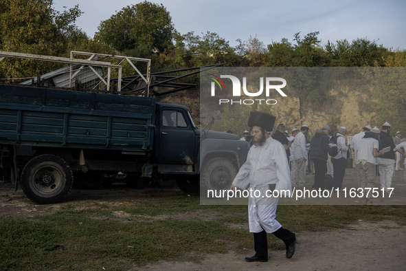 Ultra-Orthodox Jewish pilgrims are on the street near the tomb of Rabbi Nachman while celebrating Rosh Hashanah, the Jewish New Year, amid t...