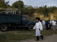 Ultra-Orthodox Jewish pilgrims are on the street near the tomb of Rabbi Nachman while celebrating Rosh Hashanah, the Jewish New Year, amid t...