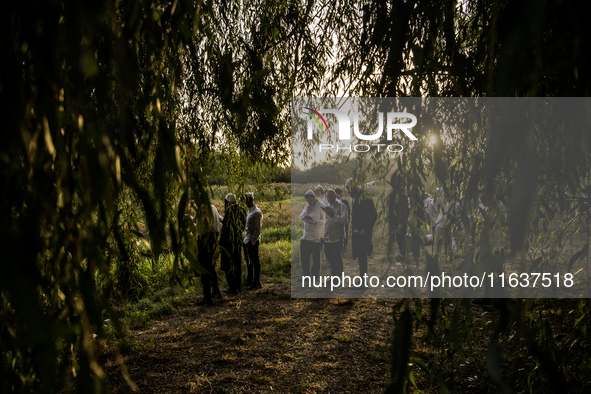 Ultra-Orthodox Jewish pilgrims pray on the bank of a lake near the tomb of Rabbi Nachman while celebrating Rosh Hashanah, the Jewish New Yea...