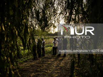 Ultra-Orthodox Jewish pilgrims pray on the bank of a lake near the tomb of Rabbi Nachman while celebrating Rosh Hashanah, the Jewish New Yea...