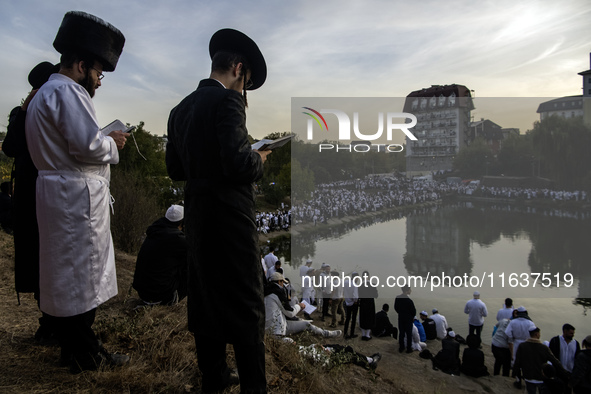 Ultra-Orthodox Jewish pilgrims pray on the bank of a lake near the tomb of Rabbi Nachman while celebrating Rosh Hashanah, the Jewish New Yea...