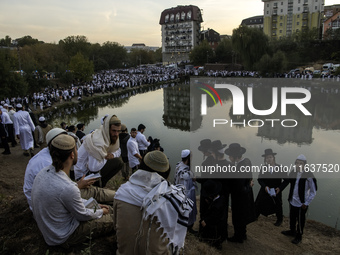 Ultra-Orthodox Jewish pilgrims pray on the bank of a lake near the tomb of Rabbi Nachman while celebrating Rosh Hashanah, the Jewish New Yea...