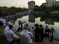 Ultra-Orthodox Jewish pilgrims pray on the bank of a lake near the tomb of Rabbi Nachman while celebrating Rosh Hashanah, the Jewish New Yea...