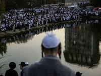 Ultra-Orthodox Jewish pilgrims pray on the bank of a lake near the tomb of Rabbi Nachman while celebrating Rosh Hashanah, the Jewish New Yea...