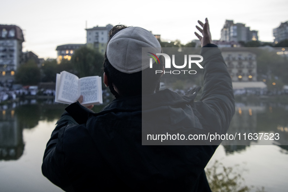 Ultra-Orthodox Jewish pilgrims pray on the bank of a lake near the tomb of Rabbi Nachman while celebrating Rosh Hashanah, the Jewish New Yea...