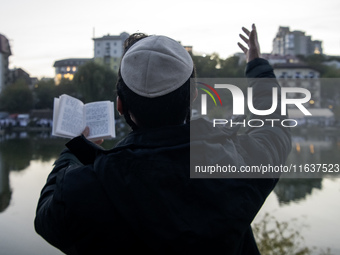 Ultra-Orthodox Jewish pilgrims pray on the bank of a lake near the tomb of Rabbi Nachman while celebrating Rosh Hashanah, the Jewish New Yea...