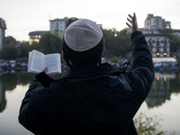 Ultra-Orthodox Jewish pilgrims pray on the bank of a lake near the tomb of Rabbi Nachman while celebrating Rosh Hashanah, the Jewish New Yea...