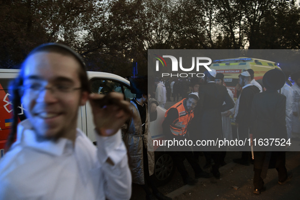 Ultra-Orthodox Jewish pilgrims are on the street near the tomb of Rabbi Nachman while celebrating Rosh Hashanah, the Jewish New Year, amid t...