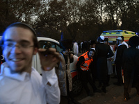 Ultra-Orthodox Jewish pilgrims are on the street near the tomb of Rabbi Nachman while celebrating Rosh Hashanah, the Jewish New Year, amid t...