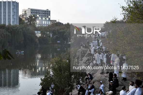 Ultra-Orthodox Jewish pilgrims pray on the bank of a lake near the tomb of Rabbi Nachman while celebrating Rosh Hashanah, the Jewish New Yea...