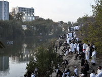 Ultra-Orthodox Jewish pilgrims pray on the bank of a lake near the tomb of Rabbi Nachman while celebrating Rosh Hashanah, the Jewish New Yea...