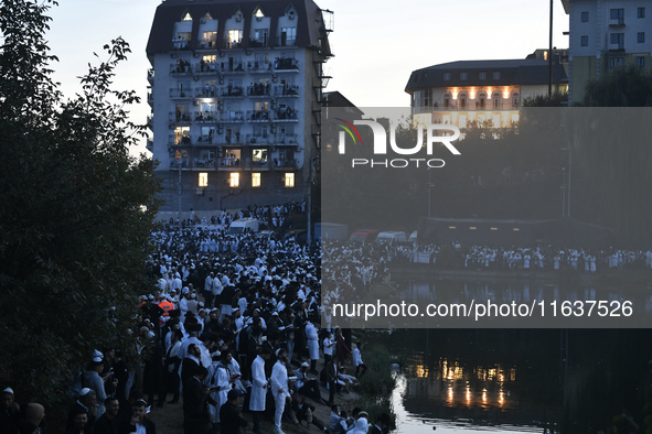 Ultra-Orthodox Jewish pilgrims pray on the bank of a lake near the tomb of Rabbi Nachman while celebrating Rosh Hashanah, the Jewish New Yea...