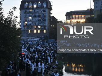 Ultra-Orthodox Jewish pilgrims pray on the bank of a lake near the tomb of Rabbi Nachman while celebrating Rosh Hashanah, the Jewish New Yea...