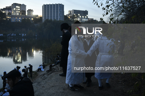 Ultra-Orthodox Jewish pilgrims dance on the bank of a lake near the tomb of Rabbi Nachman while celebrating Rosh Hashanah, the Jewish New Ye...