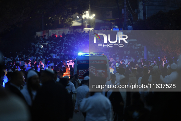 Ultra-Orthodox Jewish pilgrims are on the street near the tomb of Rabbi Nachman while celebrating Rosh Hashanah, the Jewish New Year, amid t...