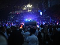 Ultra-Orthodox Jewish pilgrims are on the street near the tomb of Rabbi Nachman while celebrating Rosh Hashanah, the Jewish New Year, amid t...