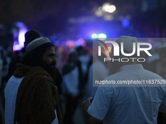 Ultra-Orthodox Jewish pilgrims are on the street near the tomb of Rabbi Nachman while celebrating Rosh Hashanah, the Jewish New Year, amid t...