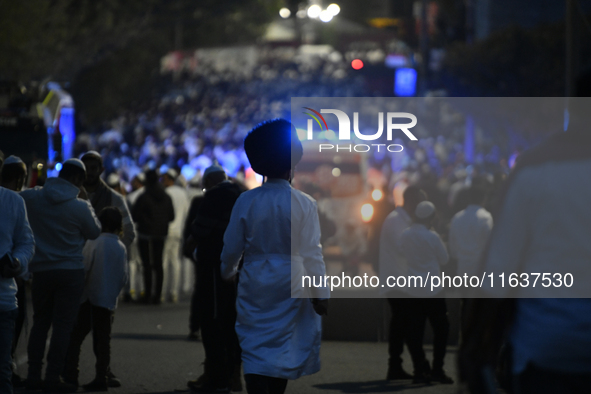 Ultra-Orthodox Jewish pilgrims are on the street near the tomb of Rabbi Nachman while celebrating Rosh Hashanah, the Jewish New Year, amid t...