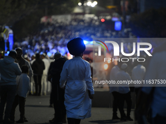 Ultra-Orthodox Jewish pilgrims are on the street near the tomb of Rabbi Nachman while celebrating Rosh Hashanah, the Jewish New Year, amid t...