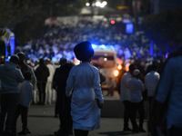 Ultra-Orthodox Jewish pilgrims are on the street near the tomb of Rabbi Nachman while celebrating Rosh Hashanah, the Jewish New Year, amid t...