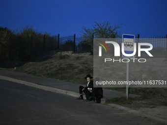 Ultra-Orthodox Jewish pilgrims are on the street near the tomb of Rabbi Nachman while celebrating Rosh Hashanah, the Jewish New Year, amid t...