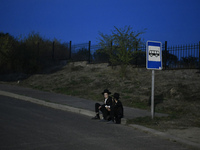 Ultra-Orthodox Jewish pilgrims are on the street near the tomb of Rabbi Nachman while celebrating Rosh Hashanah, the Jewish New Year, amid t...