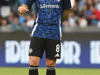 Daniele Baselli of Como warms up before the Serie A match between SSC Napoli and Como at Stadio Diego Armando Maradona Naples Italy on 4 Oct...