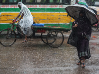 Residents of the city suffer from continuous rain in Dhaka, Bangladesh, on October 5, 2024. (