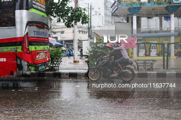 Residents of the city suffer from continuous rain in Dhaka, Bangladesh, on October 5, 2024. 