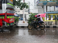 Residents of the city suffer from continuous rain in Dhaka, Bangladesh, on October 5, 2024. (