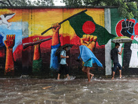 Residents of the city suffer from continuous rain in Dhaka, Bangladesh, on October 5, 2024. (