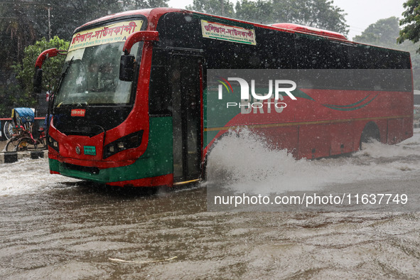 Residents of the city suffer from continuous rain in Dhaka, Bangladesh, on October 5, 2024. 