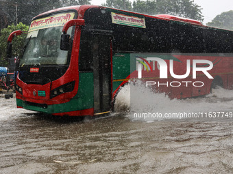 Residents of the city suffer from continuous rain in Dhaka, Bangladesh, on October 5, 2024. (