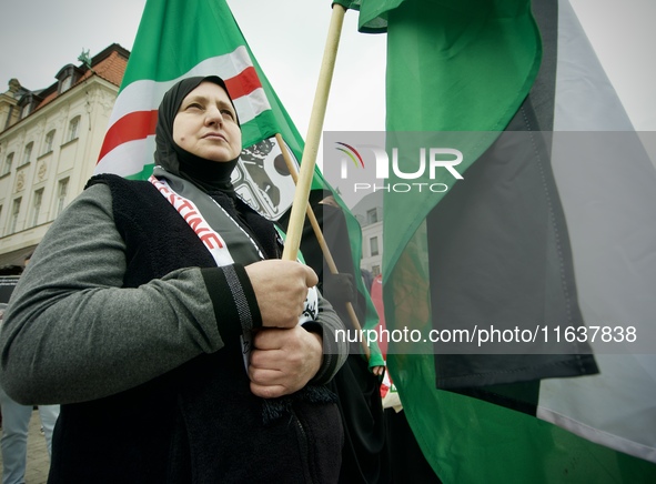 A woman wearing a hijab is seen during a rally in support of Palestine at the Royal Castle Square in Warsaw, Poland on 05 October, 2024. 