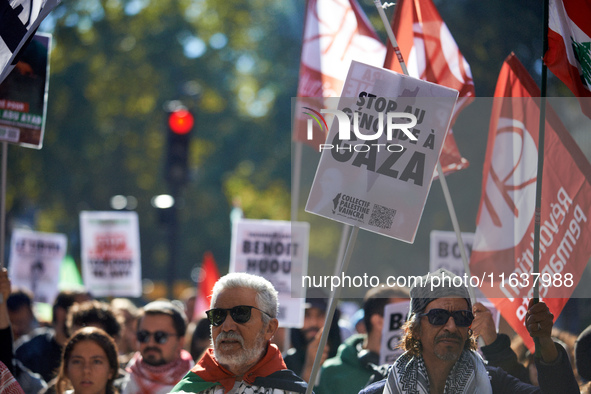 A man holds a placard reading 'Stop the genocide in Gaza'. Hundreds of people demonstrate in Toulouse, France, on October 5, 2024, in suppor...