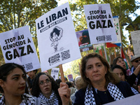 A woman holds a placard reading 'Lebanon bleeds but resists'. Hundreds of people demonstrate in Toulouse, France, on October 5, 2024, in sup...