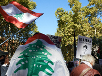 A protester is wrapped in a Lebanese flag. Hundreds of people demonstrate in Toulouse, France, on October 5, 2024, in support of Gazans, the...