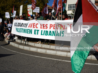 The banner reads 'Solidarity with the Palestinian and Lebanese people'. Hundreds of people demonstrate in Toulouse, France, on October 5, 20...