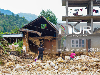 After the flood of the Nakhu River, many homes are damaged in the Bhardev region of southern Lalitpur, Nepal, on October 5, 2024. Homes are...