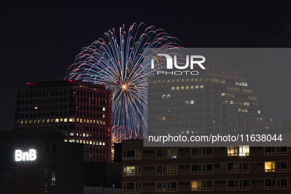 Fireworks illuminate the skyline of Yeouido during the Seoul International Fireworks Festival, drawing thousands of spectators and photograp...