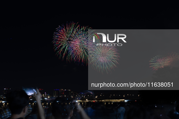 Fireworks illuminate the skyline of Yeouido during the Seoul International Fireworks Festival, drawing thousands of spectators and photograp...